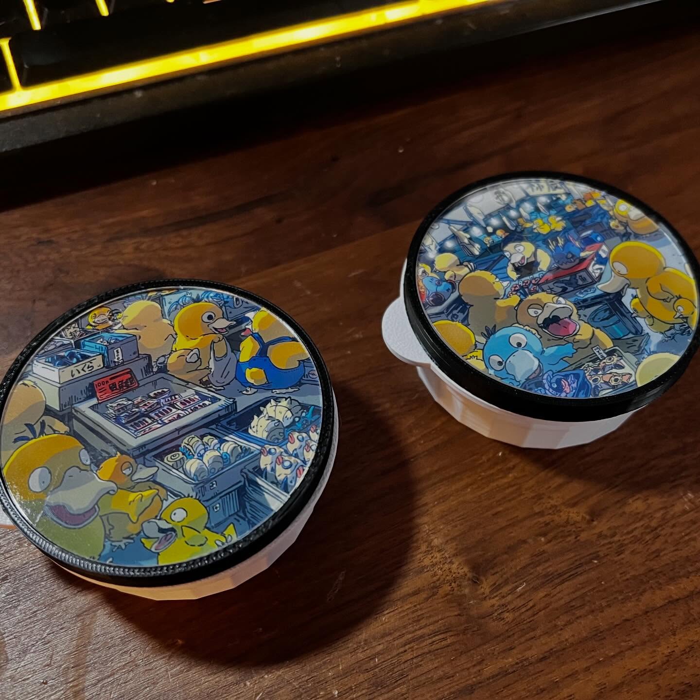 Custom 3D-printed Pokemon Psyduck themed badminton tube caps in black and white by Capminton